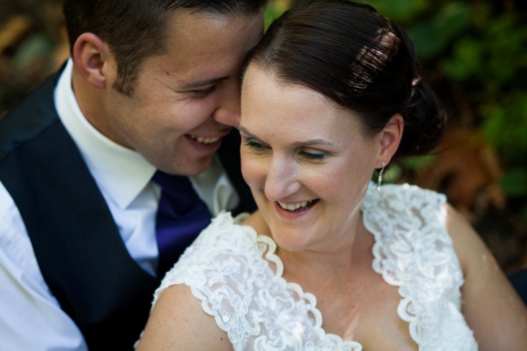 close up of bride and groom smiling