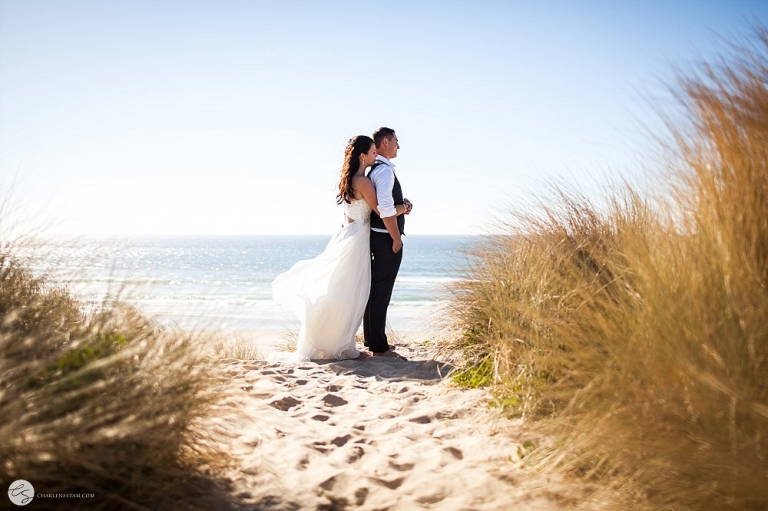 brides and groom on beach