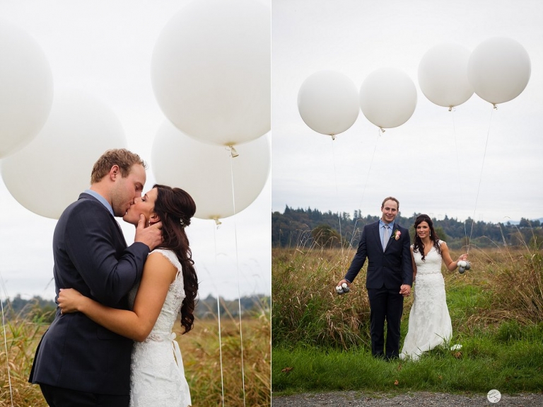 bride and groom kissing with white balloons