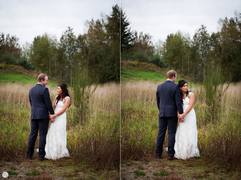 bride and groom standing in field of long grasses