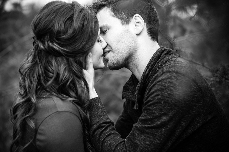 black and white photo of boy and girl kissing