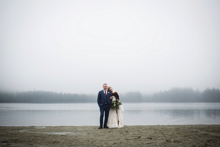 bride and groom in front of whonnock lake