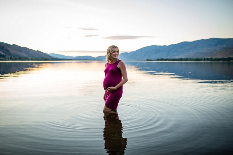 pregnant woman standing in osoyoos lake