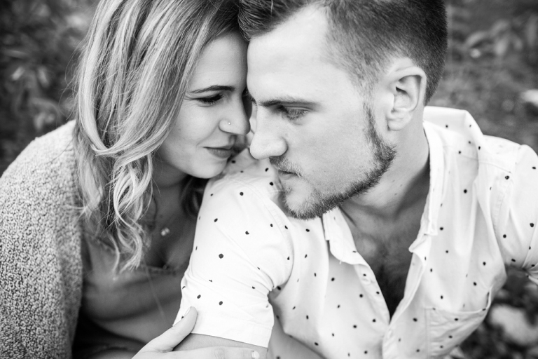 black and white photo of couple looking into eachothers eyes