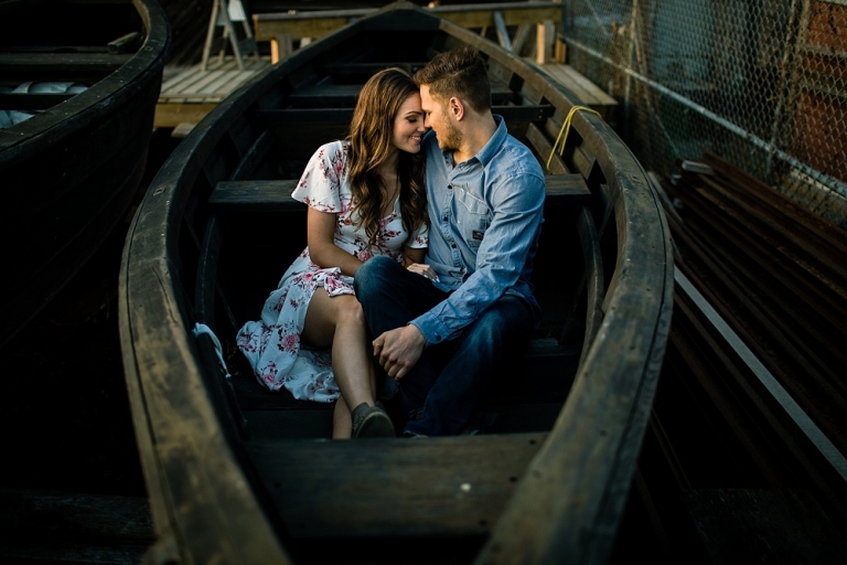 engaged couple in a rowboat
